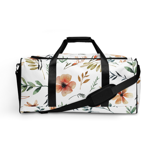 Duffelväska i polyester med svart rem och akvarellmålade blommor och blad i mjuka färger på vit botten.
Polyester duffel bag with black strap and watercolor-style flowers and leaves in soft tones on a white background.