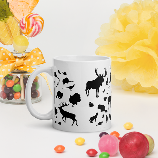 Vit blank keramikmugg 11 oz med svarta djursiluetter.
White glossy ceramic mug 11 oz with black animal silhouettes.