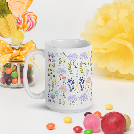 Vit keramikmugg 15 oz med färgglatt blommönster.
White ceramic mug 15 oz with a colorful floral pattern.